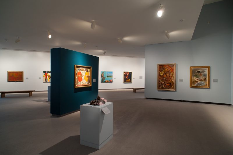 Interior image of the galleries showing paintings on the walls and sculpture on pedestals